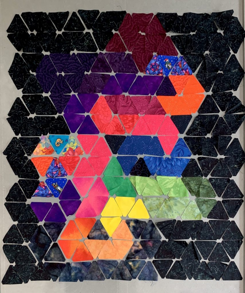 Peer Gynt quilt laid out in separate triangles